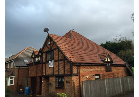 Roof Cleaning with Protective Biocide Treatment